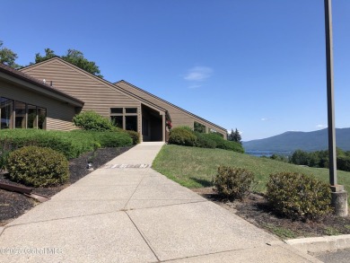 Incredible lake views from this Top of the World townhome. This on Top Of The World Golf Resort in New York - for sale on GolfHomes.com, golf home, golf lot