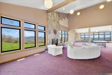 Incredible lake views from this Top of the World townhome. This on Top Of The World Golf Resort in New York - for sale on GolfHomes.com, golf home, golf lot