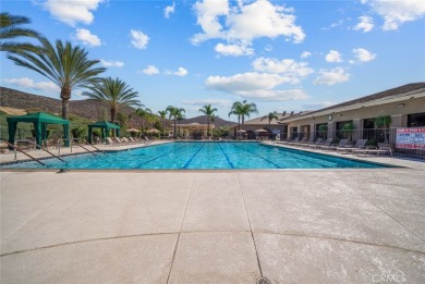 This beautifully maintained Trento model is located in The Oasis on Menifee Lakes Country Club - Lakes in California - for sale on GolfHomes.com, golf home, golf lot