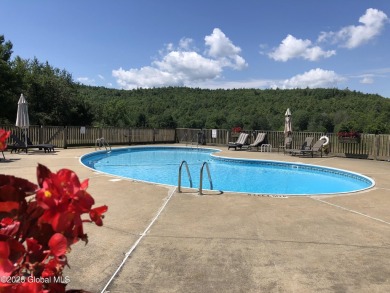 Incredible lake views from this Top of the World townhome. This on Top Of The World Golf Resort in New York - for sale on GolfHomes.com, golf home, golf lot