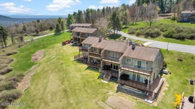 Incredible lake views from this Top of the World townhome. This on Top Of The World Golf Resort in New York - for sale on GolfHomes.com, golf home, golf lot