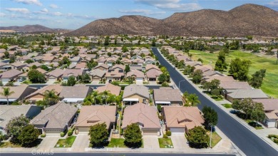 This beautifully maintained Trento model is located in The Oasis on Menifee Lakes Country Club - Lakes in California - for sale on GolfHomes.com, golf home, golf lot