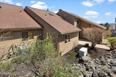 Incredible lake views from this Top of the World townhome. This on Top Of The World Golf Resort in New York - for sale on GolfHomes.com, golf home, golf lot