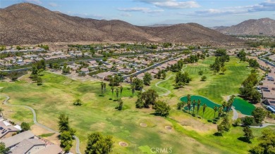 This beautifully maintained Trento model is located in The Oasis on Menifee Lakes Country Club - Lakes in California - for sale on GolfHomes.com, golf home, golf lot