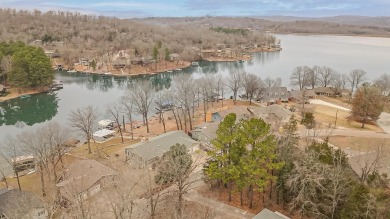 Wake up to stunning lake views and enjoy the best of waterfront on Cherokee Village North Course in Arkansas - for sale on GolfHomes.com, golf home, golf lot