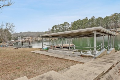 Wake up to stunning lake views and enjoy the best of waterfront on Cherokee Village North Course in Arkansas - for sale on GolfHomes.com, golf home, golf lot