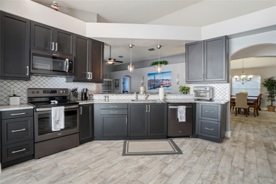 Imagine a place where every day feels like a pause button on on Heritage Isles Golf and Country Club in Florida - for sale on GolfHomes.com, golf home, golf lot