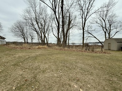 Discover Your Perfect Retreat on Duck Lake! Unlock the potential on Duck Lake Country Club in Michigan - for sale on GolfHomes.com, golf home, golf lot