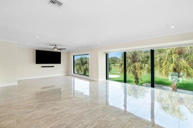 Exceptional residence with sweeping golf course views. Step into on Quail Ridge Golf Course and Country Club in Florida - for sale on GolfHomes.com, golf home, golf lot