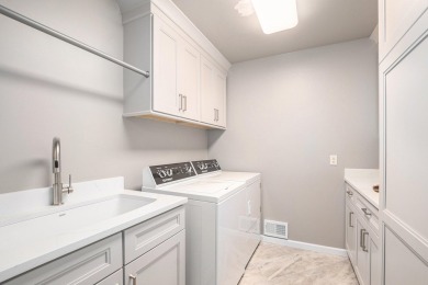Experience the best of both worlds in this beautifully appointed on HawksHead Links in Michigan - for sale on GolfHomes.com, golf home, golf lot