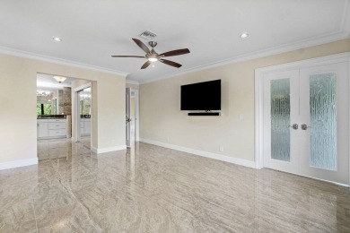 Exceptional residence with sweeping golf course views. Step into on Quail Ridge Golf Course and Country Club in Florida - for sale on GolfHomes.com, golf home, golf lot