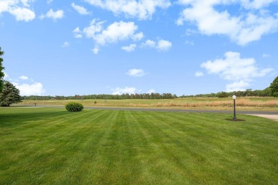 Experience the best of both worlds in this beautifully appointed on HawksHead Links in Michigan - for sale on GolfHomes.com, golf home, golf lot