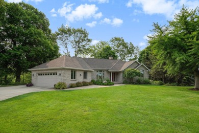 Experience the best of both worlds in this beautifully appointed on HawksHead Links in Michigan - for sale on GolfHomes.com, golf home, golf lot