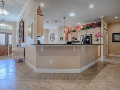 LOVELY CUSTOM EXPANDED WILLIAMSBURG PREMIER home with over 3000 on Palmer Legends Country Club in Florida - for sale on GolfHomes.com, golf home, golf lot