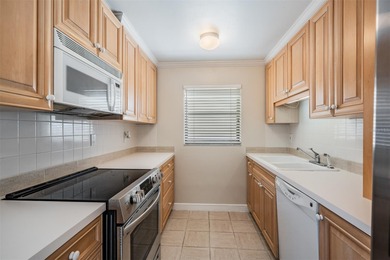 Here is your rare opportunity to own a spacious 1,345 square on Cove Cay Country Club in Florida - for sale on GolfHomes.com, golf home, golf lot