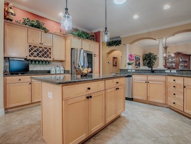 LOVELY CUSTOM EXPANDED WILLIAMSBURG PREMIER home with over 3000 on Palmer Legends Country Club in Florida - for sale on GolfHomes.com, golf home, golf lot