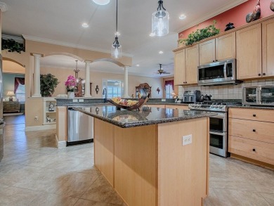 LOVELY CUSTOM EXPANDED WILLIAMSBURG PREMIER home with over 3000 on Palmer Legends Country Club in Florida - for sale on GolfHomes.com, golf home, golf lot