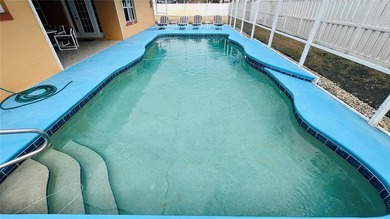 Welcome to 34 Woodfield Drive, a beautifully maintained on The Grand Club - Pine Lakes Course in Florida - for sale on GolfHomes.com, golf home, golf lot