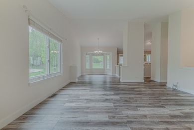 Absolutely beautiful Woodland Green end unit ranch with sunny on Fox Lake Country Club, Inc. in Illinois - for sale on GolfHomes.com, golf home, golf lot