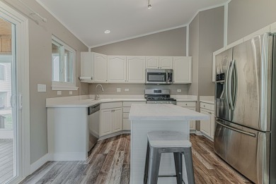 Absolutely beautiful Woodland Green end unit ranch with sunny on Fox Lake Country Club, Inc. in Illinois - for sale on GolfHomes.com, golf home, golf lot