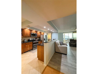 Welcome to this exquisitely updated 3-bedroom, 2-bath top-floor on Feather Sound Country Club in Florida - for sale on GolfHomes.com, golf home, golf lot