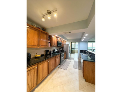 Welcome to this exquisitely updated 3-bedroom, 2-bath top-floor on Feather Sound Country Club in Florida - for sale on GolfHomes.com, golf home, golf lot