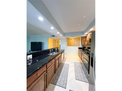 Welcome to this exquisitely updated 3-bedroom, 2-bath top-floor on Feather Sound Country Club in Florida - for sale on GolfHomes.com, golf home, golf lot