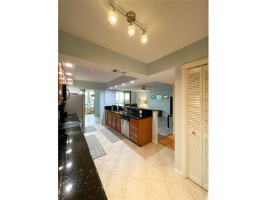 Welcome to this exquisitely updated 3-bedroom, 2-bath top-floor on Feather Sound Country Club in Florida - for sale on GolfHomes.com, golf home, golf lot
