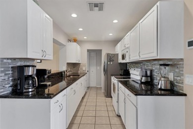 Flamingo house. Charming Floridian home, meticulously maintained on Jacaranda West Country Club in Florida - for sale on GolfHomes.com, golf home, golf lot