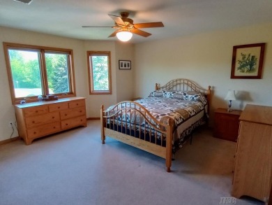 Stunning End-Unit Condo on Lake Lancer -- A Rare Lakeside Gem on Lakeside Golf Course in Michigan - for sale on GolfHomes.com, golf home, golf lot