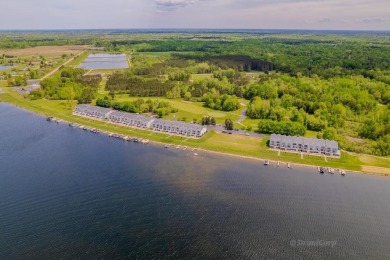 Stunning End-Unit Condo on Lake Lancer -- A Rare Lakeside Gem on Lakeside Golf Course in Michigan - for sale on GolfHomes.com, golf home, golf lot