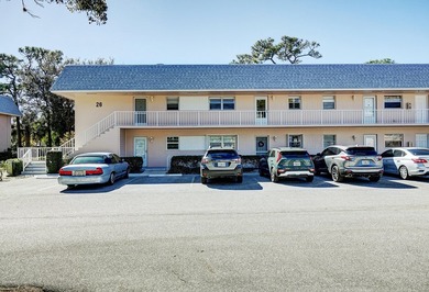 Freshly painted 2/1.5 second floor condo in the 55+ community of on The Little Club in Florida - for sale on GolfHomes.com, golf home, golf lot