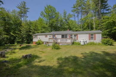 Check out this beautiful and super well-maintained mobile home on Belgrade Lakes Golf Club in Maine - for sale on GolfHomes.com, golf home, golf lot