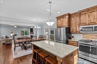 Tucked inside the Village of Highlands South, this 4-bedroom on Highland Oaks Golf Course in Alabama - for sale on GolfHomes.com, golf home, golf lot