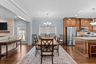 Tucked inside the Village of Highlands South, this 4-bedroom on Highland Oaks Golf Course in Alabama - for sale on GolfHomes.com, golf home, golf lot