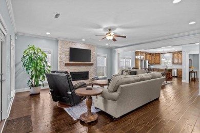 Tucked inside the Village of Highlands South, this 4-bedroom on Highland Oaks Golf Course in Alabama - for sale on GolfHomes.com, golf home, golf lot