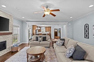 Tucked inside the Village of Highlands South, this 4-bedroom on Highland Oaks Golf Course in Alabama - for sale on GolfHomes.com, golf home, golf lot