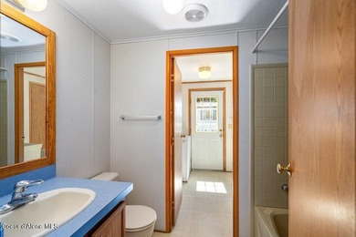 Tucked into a quiet Hayden community, this newly updated on Hayden Lake Country Club in Idaho - for sale on GolfHomes.com, golf home, golf lot