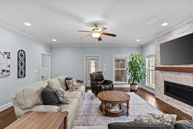 Tucked inside the Village of Highlands South, this 4-bedroom on Highland Oaks Golf Course in Alabama - for sale on GolfHomes.com, golf home, golf lot