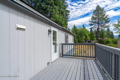 Tucked into a quiet Hayden community, this newly updated on Hayden Lake Country Club in Idaho - for sale on GolfHomes.com, golf home, golf lot