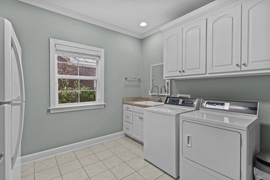 Tucked inside the Village of Highlands South, this 4-bedroom on Highland Oaks Golf Course in Alabama - for sale on GolfHomes.com, golf home, golf lot