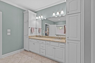 Tucked inside the Village of Highlands South, this 4-bedroom on Highland Oaks Golf Course in Alabama - for sale on GolfHomes.com, golf home, golf lot