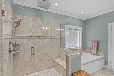 Tucked inside the Village of Highlands South, this 4-bedroom on Highland Oaks Golf Course in Alabama - for sale on GolfHomes.com, golf home, golf lot