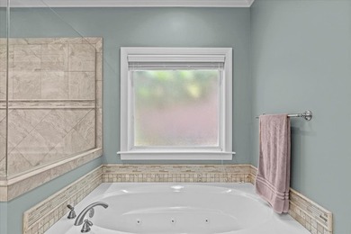 Tucked inside the Village of Highlands South, this 4-bedroom on Highland Oaks Golf Course in Alabama - for sale on GolfHomes.com, golf home, golf lot