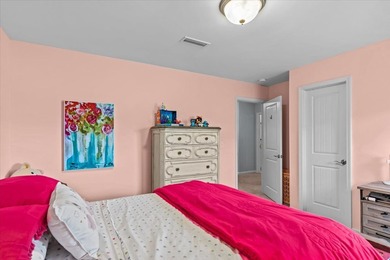 Tucked inside the Village of Highlands South, this 4-bedroom on Highland Oaks Golf Course in Alabama - for sale on GolfHomes.com, golf home, golf lot