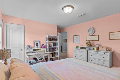 Tucked inside the Village of Highlands South, this 4-bedroom on Highland Oaks Golf Course in Alabama - for sale on GolfHomes.com, golf home, golf lot