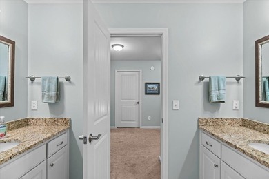 Tucked inside the Village of Highlands South, this 4-bedroom on Highland Oaks Golf Course in Alabama - for sale on GolfHomes.com, golf home, golf lot