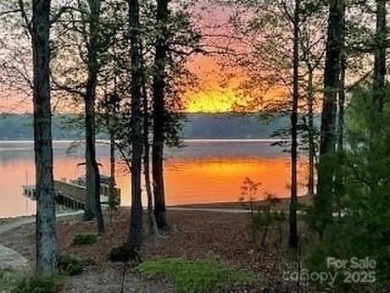 Fabulous lakefront home featuring incredible sunrise views of on Old North State Club at Uwharrie Point Golf community in North Carolina - for sale on GolfHomes.com, golf home, golf lot