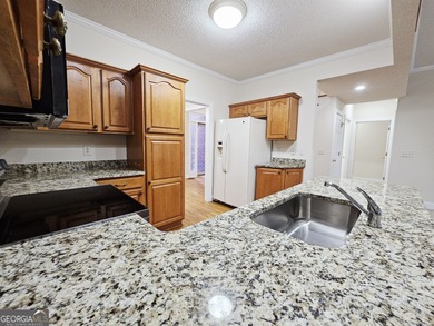 Welcome home to this beautifully maintained townhome nestled on on Barrington Hall Golf Course in Georgia - for sale on GolfHomes.com, golf home, golf lot