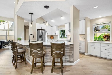 Nestled in the heart of Boca Raton's prestigious Hidden Valley on Ocean Breeze Golf and Country Club in Florida - for sale on GolfHomes.com, golf home, golf lot